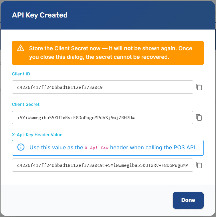 Create API Key dialog showing the generated Client ID and Client Secret with copy buttons